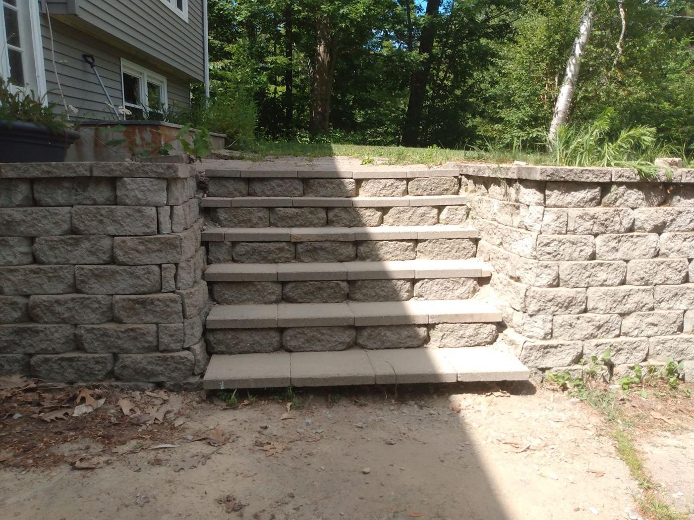 Stone steps between two retaining walls