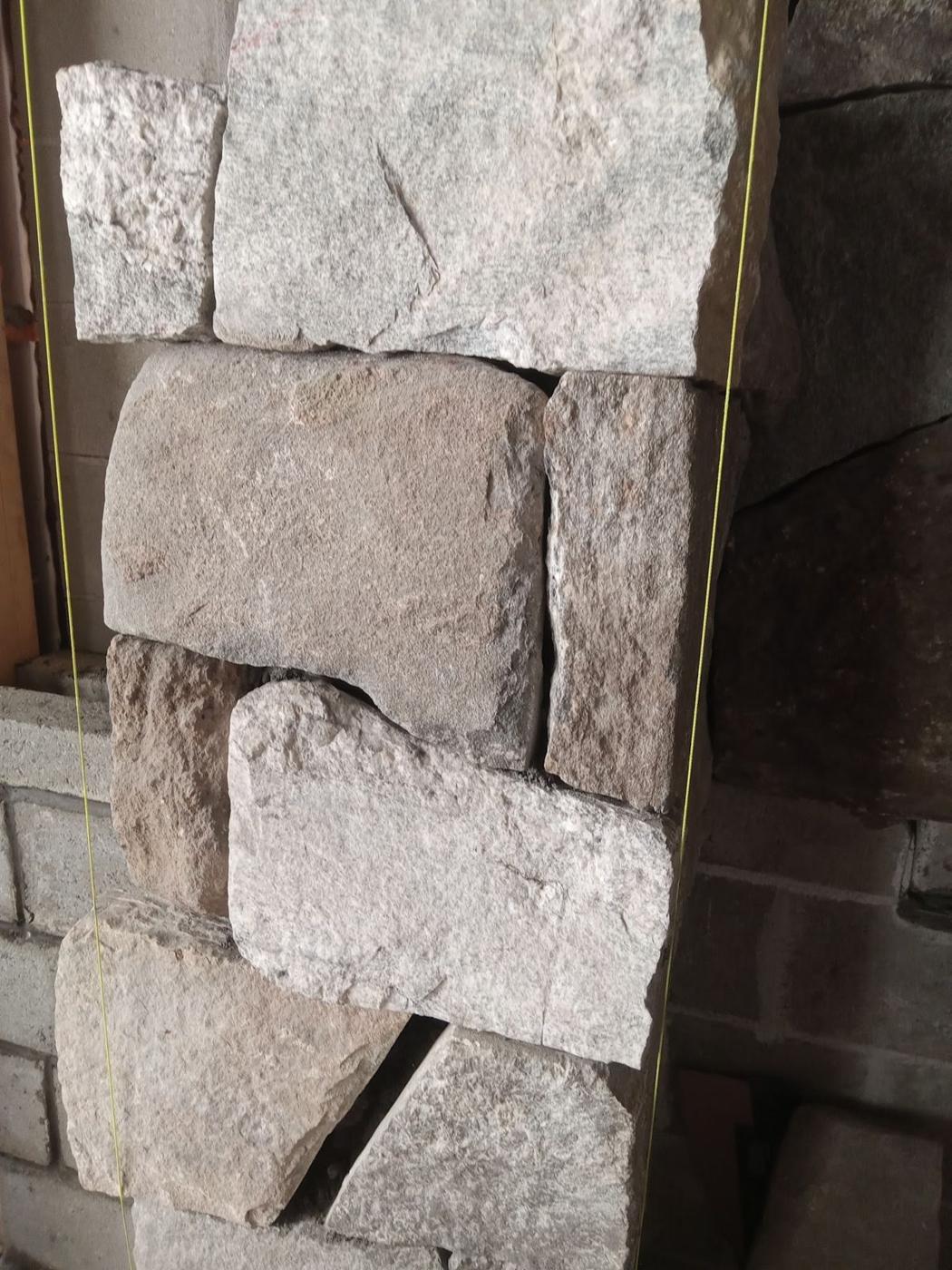 Cut granite veneer on a wall